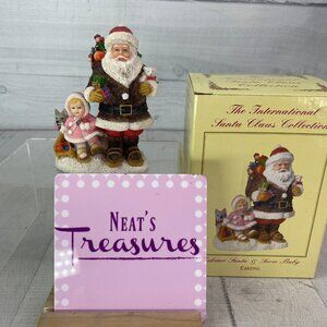 The International Santa Claus Collection Handcrafted Eskimo Santa & Snow Baby